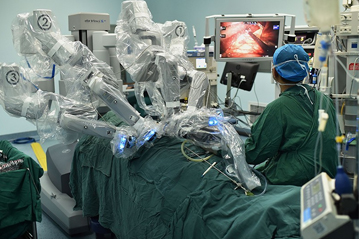 Surgeon operating a robotic surgical system during a minimally invasive procedure, highlighting the role of medical robotics in advanced healthcare